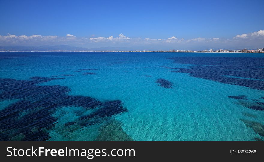The perfectly beautiful blue waters of the Mediterranean Sea off the cost of the island of Majorca. The perfectly beautiful blue waters of the Mediterranean Sea off the cost of the island of Majorca.