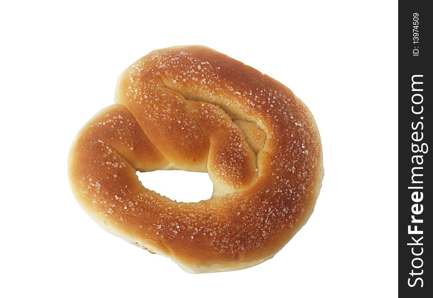 The pretzel from wheat flour close up on a white background is isolated