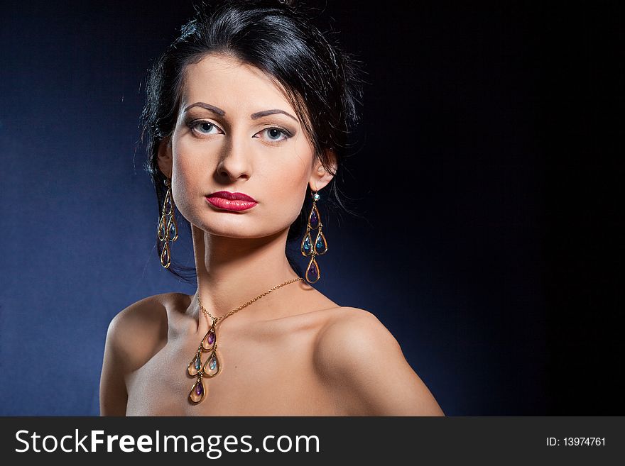 Portrait of elegant beautiful woman wearing jewelry.