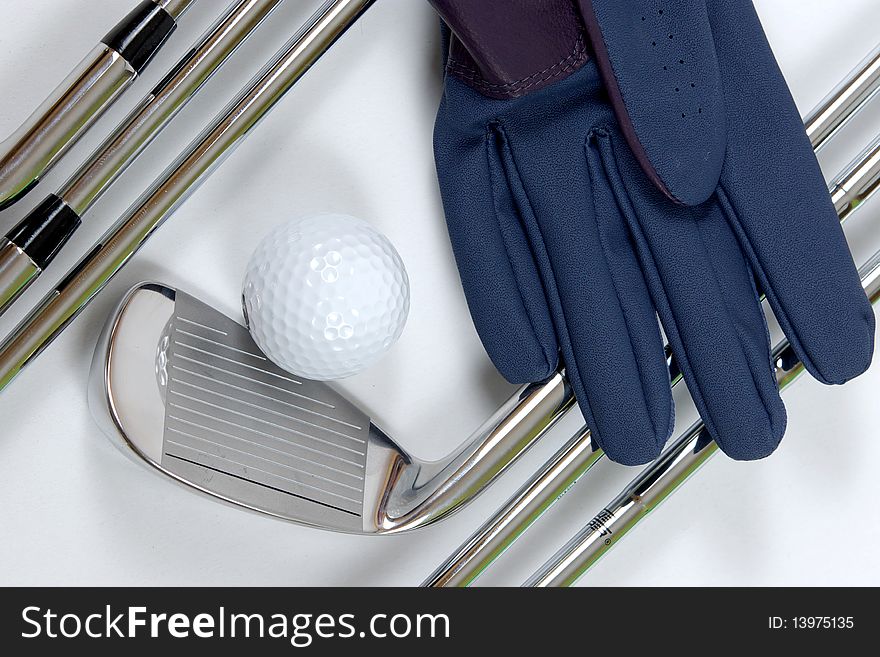 Golf clubs with glove on white background. Golf clubs with glove on white background