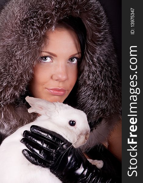 Picture of cute girl with white rabbit in her hands. Picture of cute girl with white rabbit in her hands