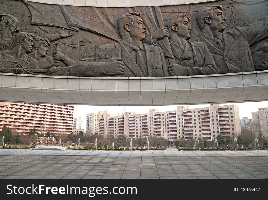 The political sculpture in front of the residential area. Korean characters on political sculpture is Juche idea. The political sculpture in front of the residential area. Korean characters on political sculpture is Juche idea.