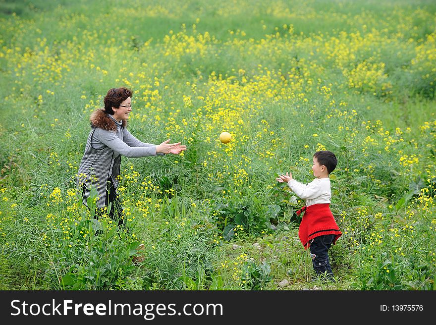 Mother and son outdoor in flowers. Mother and son outdoor in flowers.