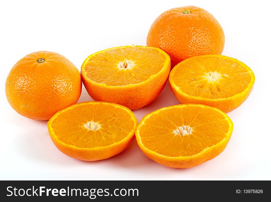 Juicy half orange, fresh fruit against a white background
