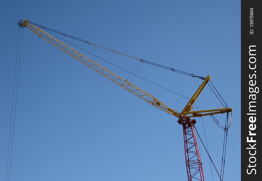 Big hoisting crane on a building site