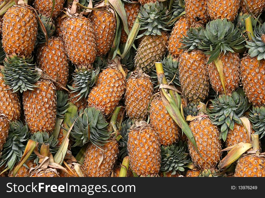 Pineapples in a market place