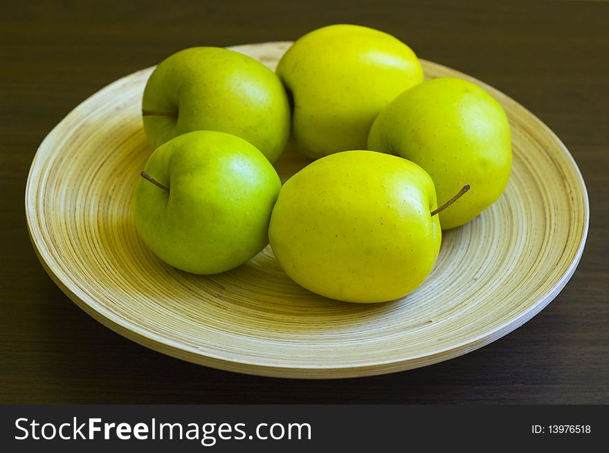 Green apple on a plate