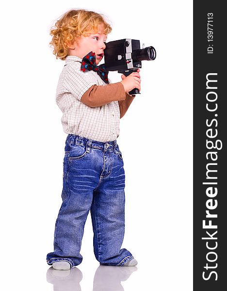 The little boy with an old videocamera in hands. The little boy with an old videocamera in hands