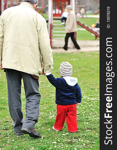 Parent with baby on park