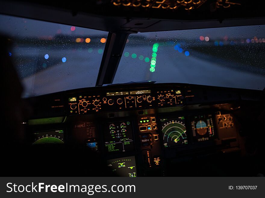 Pilot`s hand accelerating on the throttle in airplane flight cockpit during takeoff