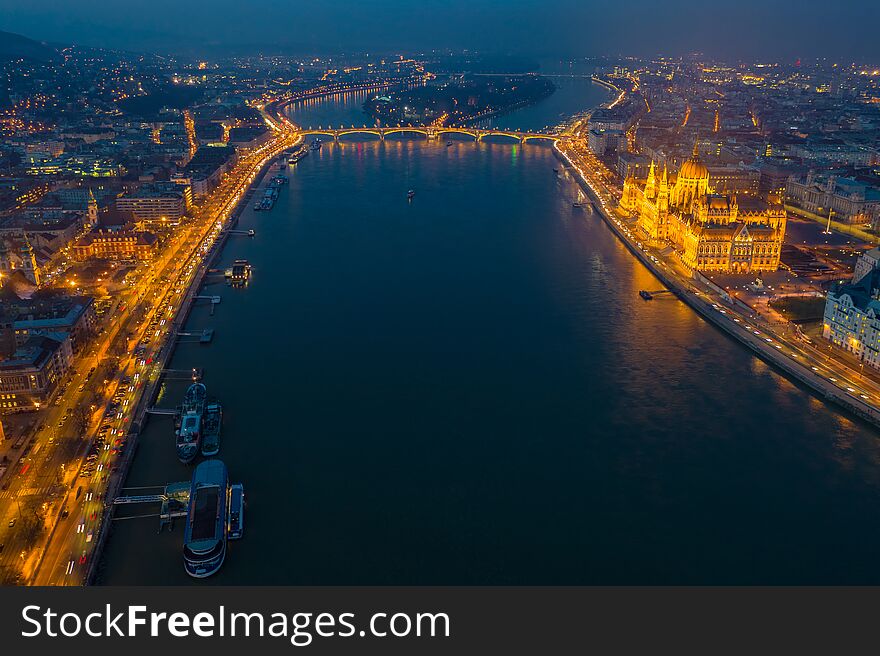 Budapest, Hungary - Aerial skyline view of Budapest by night with illuminated Parliament, Margaret Bridge and riverside