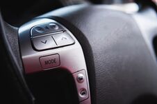 Close Up Steering Wheel With Control Buttons Close-up. Car Stereo System Control Royalty Free Stock Images