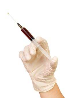 Hand With A Syringe Stock Photo
