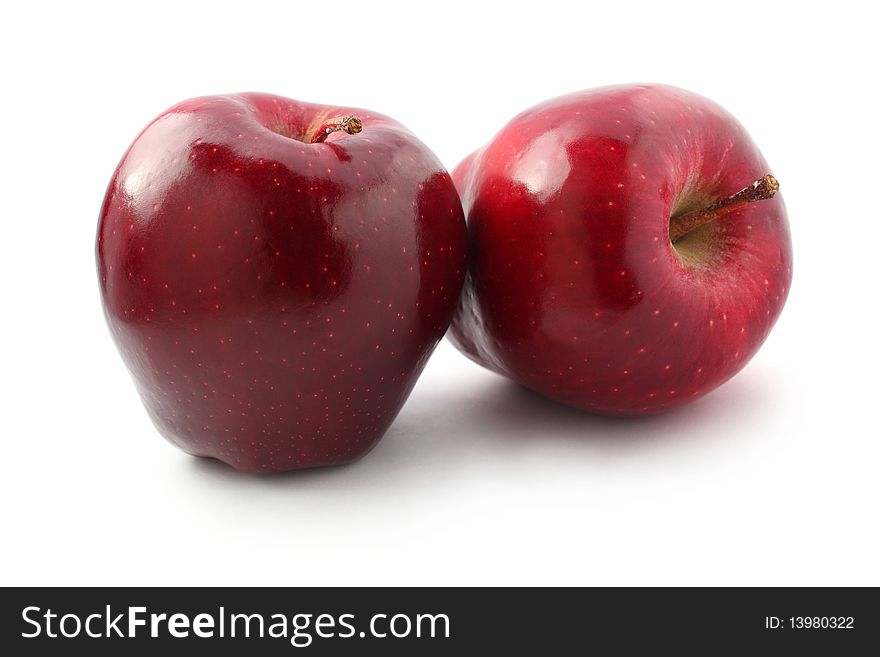 Two perfect red apples isolated on white background. Two perfect red apples isolated on white background.