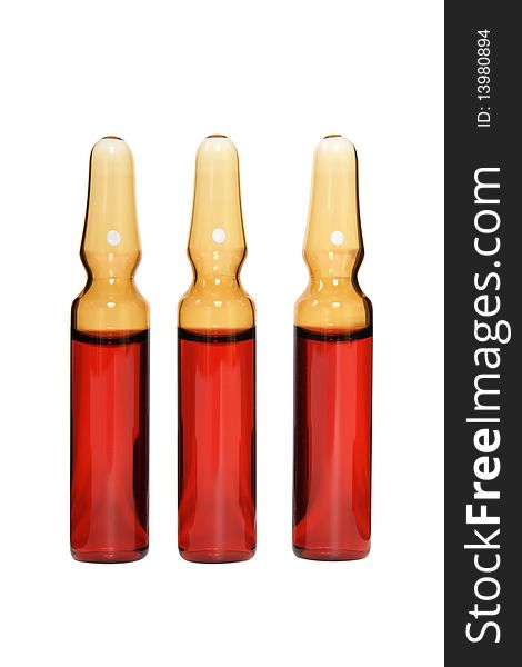 Red ampoules on a white background it is isolated