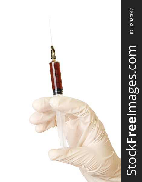 Hand with a syringe