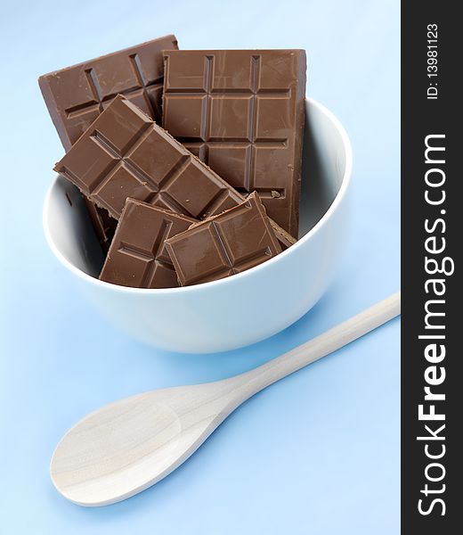 Packaged cooking chocolate isolated against a blue background