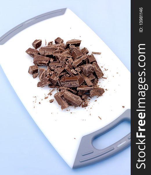 Packaged cooking chocolate isolated against a blue background