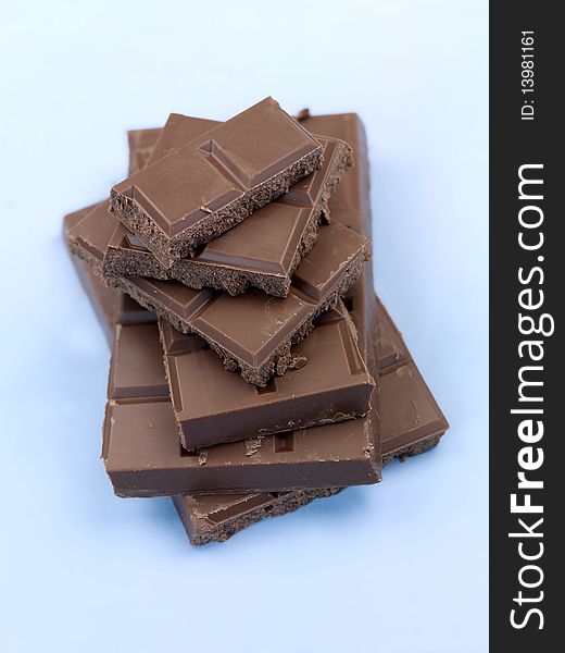 Packaged cooking chocolate isolated against a blue background