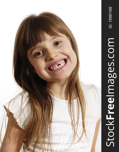Smiling girl without the tooth on the white background. Smiling girl without the tooth on the white background