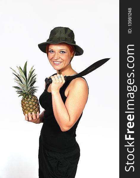 Smiling girl with the machete on the shoulder and with pineapple in the hand. Smiling girl with the machete on the shoulder and with pineapple in the hand