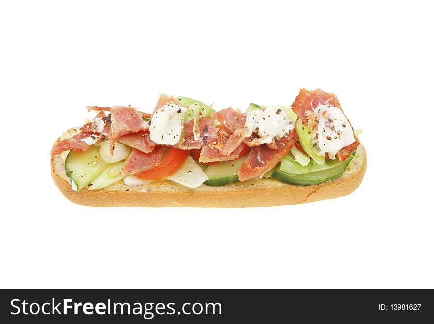 Open bacon and salad roll isolated on white