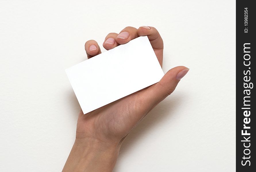 Hand holding an empty business card over white 1