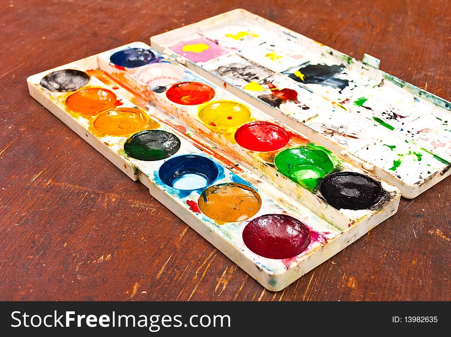 Water colour paints on wooden board