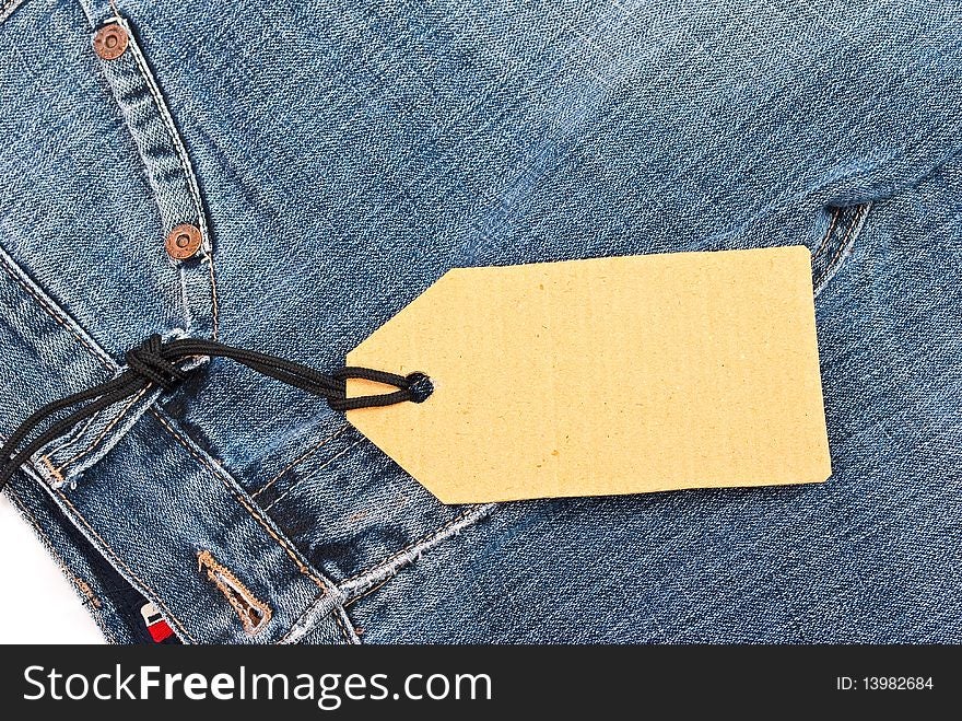 Price tag over jeans background