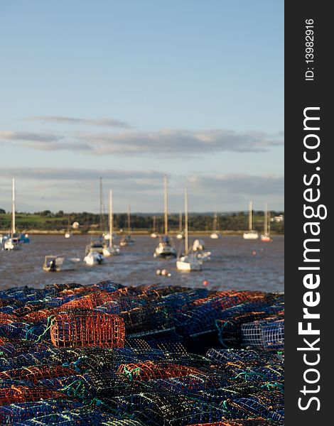 Lobster traps with Alvor boats on the background. Lobster traps with Alvor boats on the background.