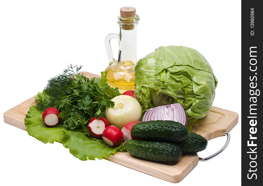 Fresh green-stuffs on cutting board on white background