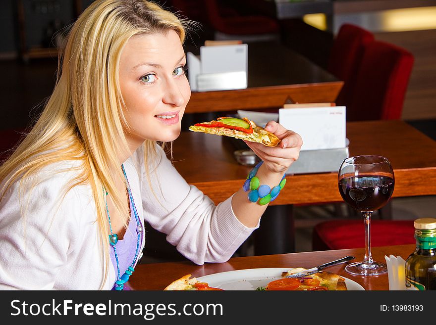 Young Woman Eating Dinner