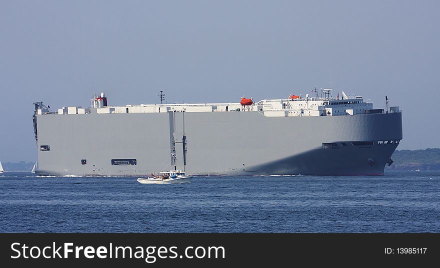 Small boat  and Tanker sailing in the ocean