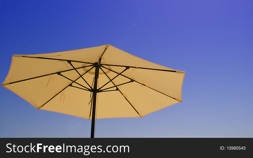 Parasol on the beach on a sunny day. Parasol on the beach on a sunny day