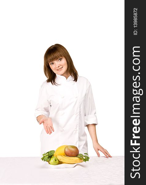 Girl cook shows fruit on white background