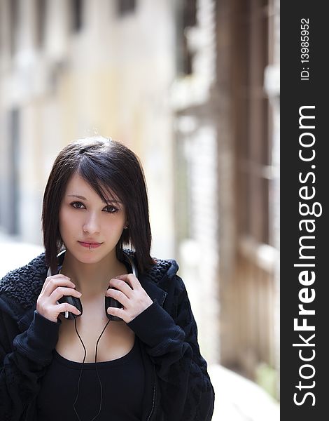 Young beautiful pierced girl with headphones. Young beautiful pierced girl with headphones.