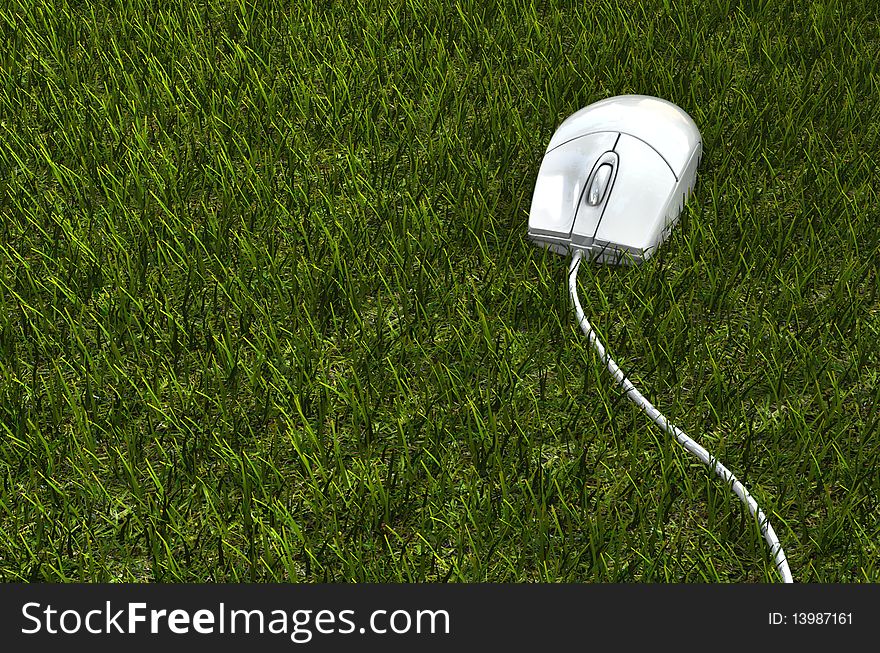 A computer mouse on the grass