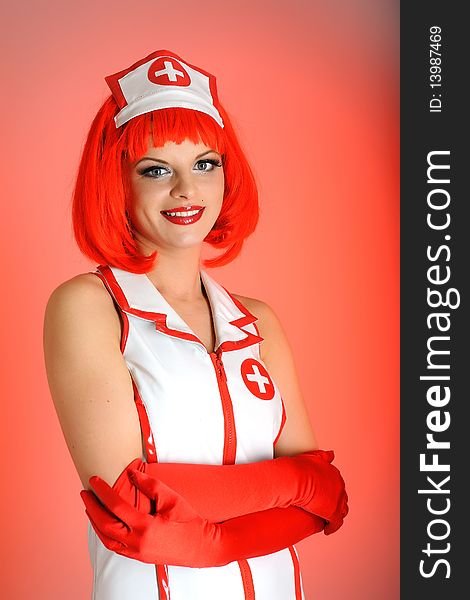 Young nurse with red hair. red background. Young nurse with red hair. red background