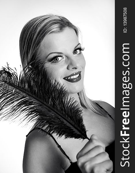 B/w Portrait of fashion woman with red lips in black dress with bird feather. white background. B/w Portrait of fashion woman with red lips in black dress with bird feather. white background