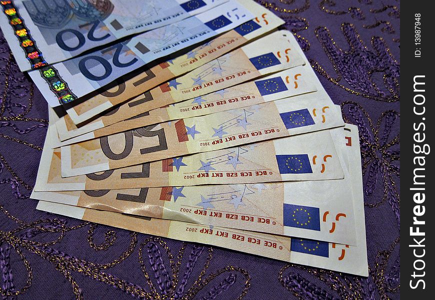Euro banknotes displayed on a surface. Euro banknotes displayed on a surface