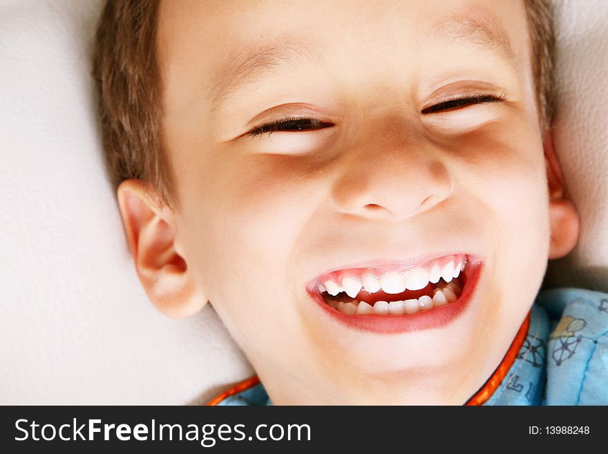 Four years old boy laughing over white background. Happiness concept. Four years old boy laughing over white background. Happiness concept