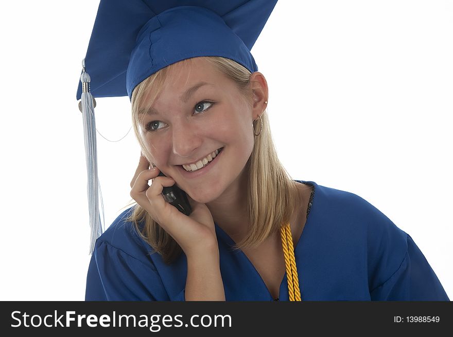 Happy pretty girl graduate in gown talking on mobile phone. Happy pretty girl graduate in gown talking on mobile phone