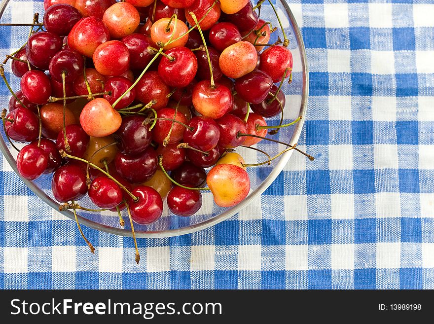 Food series: red and yellow ripe cherries on plate. Food series: red and yellow ripe cherries on plate