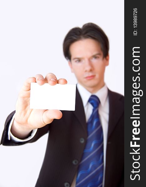 Business card conceptual image. Businessman holding a blank business card.