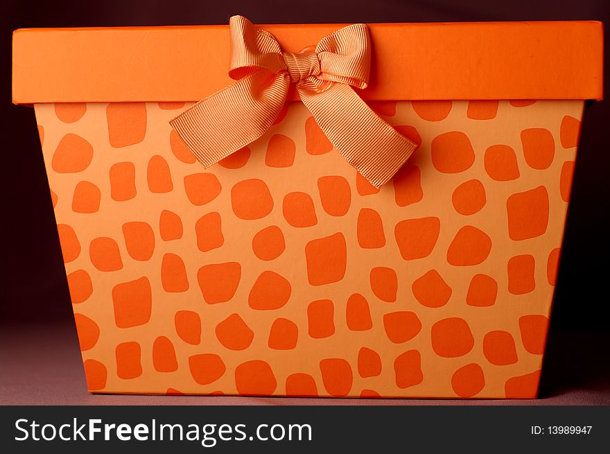 Orange gift box with bow