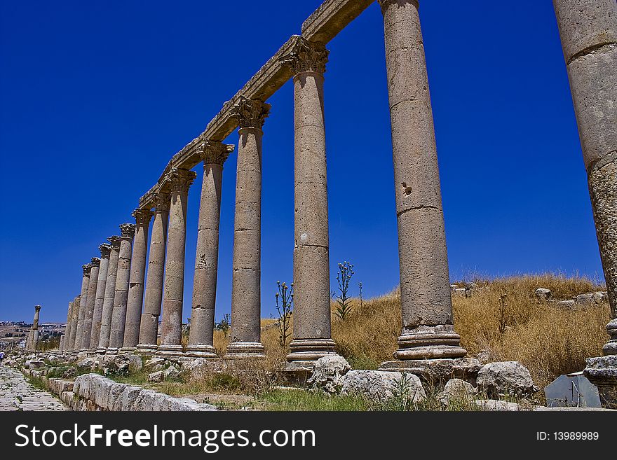 Photo of the Pillars street in the ancient Roman city located in Jerash - Jordan. Photo of the Pillars street in the ancient Roman city located in Jerash - Jordan