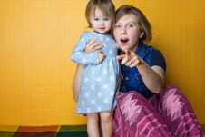 Free Portrait Of Mother Hugging Toddler Daughter. Pretty, Amazed Girl Look To Camera. Woman, Person Point At Surprise By Stock Image - 139834431