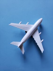 White Plastic Airplane And Blue Background Stock Photography