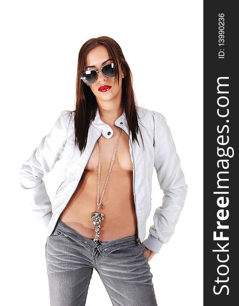 A pretty woman, topless with a light gray jacket and jeans and sunglasses, standing in the studio with bare stomach and nice jewelry, over white. A pretty woman, topless with a light gray jacket and jeans and sunglasses, standing in the studio with bare stomach and nice jewelry, over white.