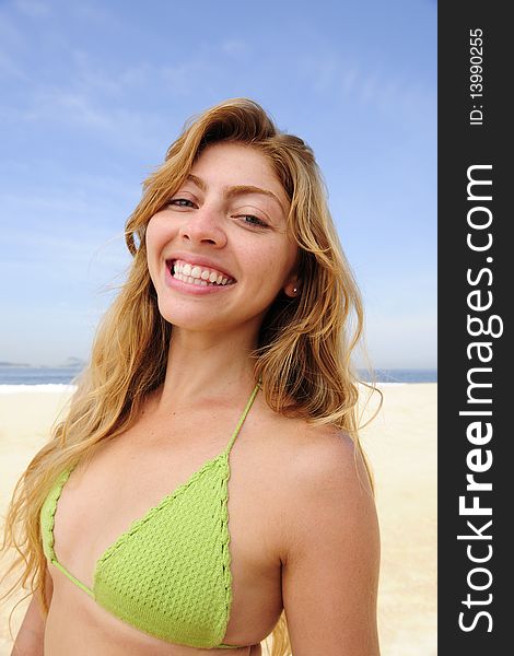 Summer vacation: beautiful blond woman enjoying the beach